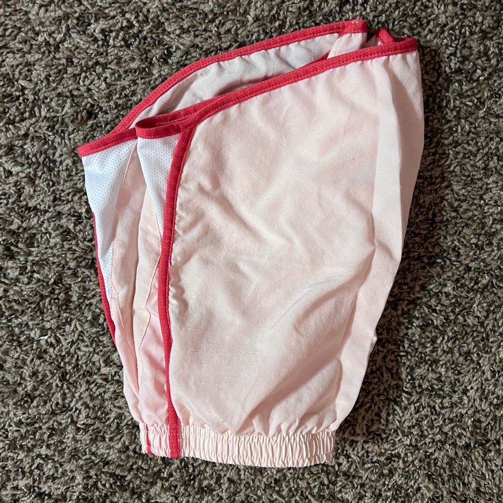 Baby pink Nike running shorts